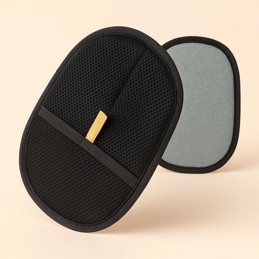 Two pet grooming gloves shown front and back, featuring a black mesh side and a textured grey cleaning surface.