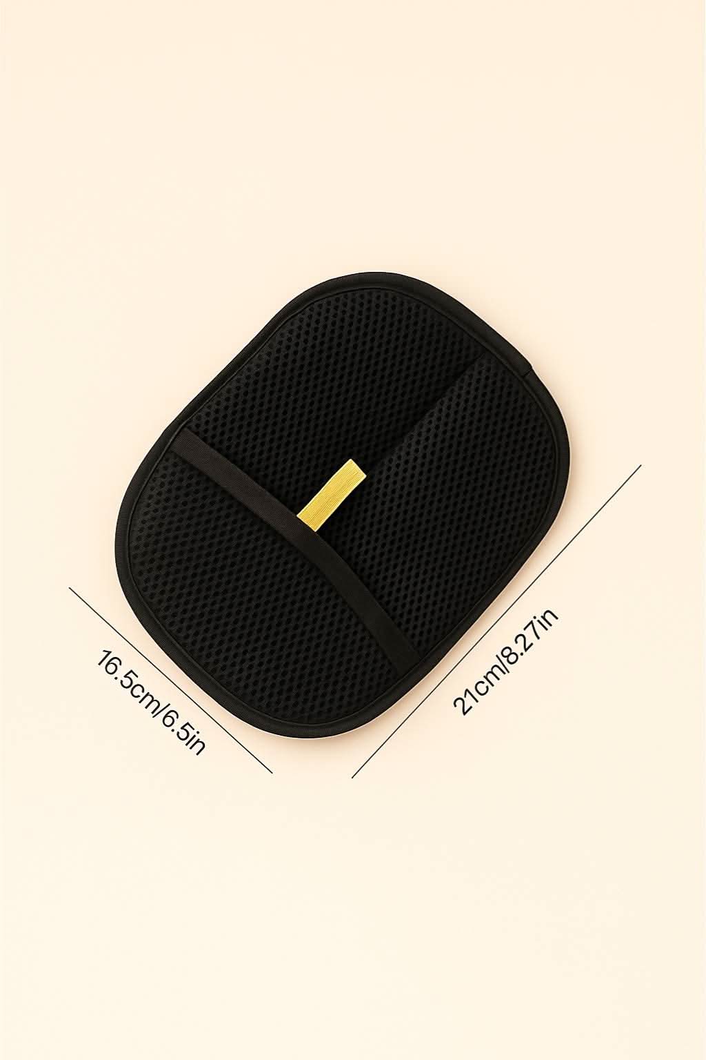 Black oval-shaped grooming glove laid flat with dimensions 21 cm by 16.5 cm displayed on beige background.