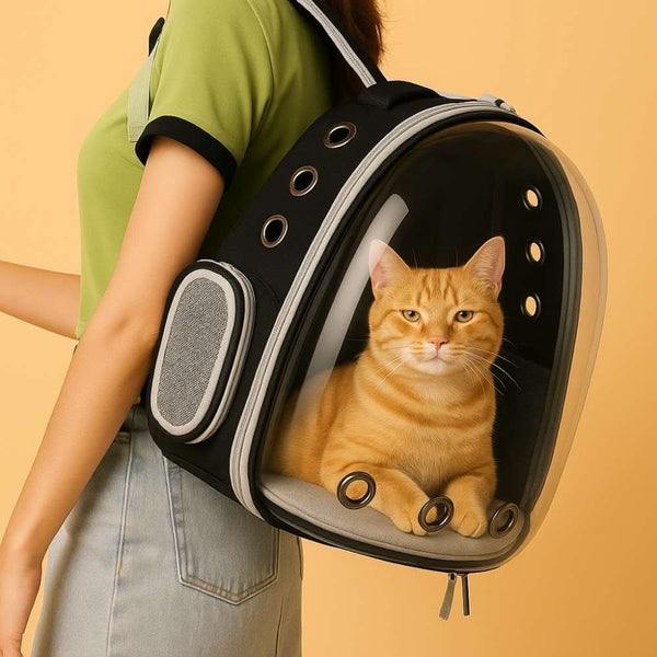 Woman carrying the FluffyDen™ ClearView Pet Backpack with a ginger cat inside, showing side ventilation and transparent front.

